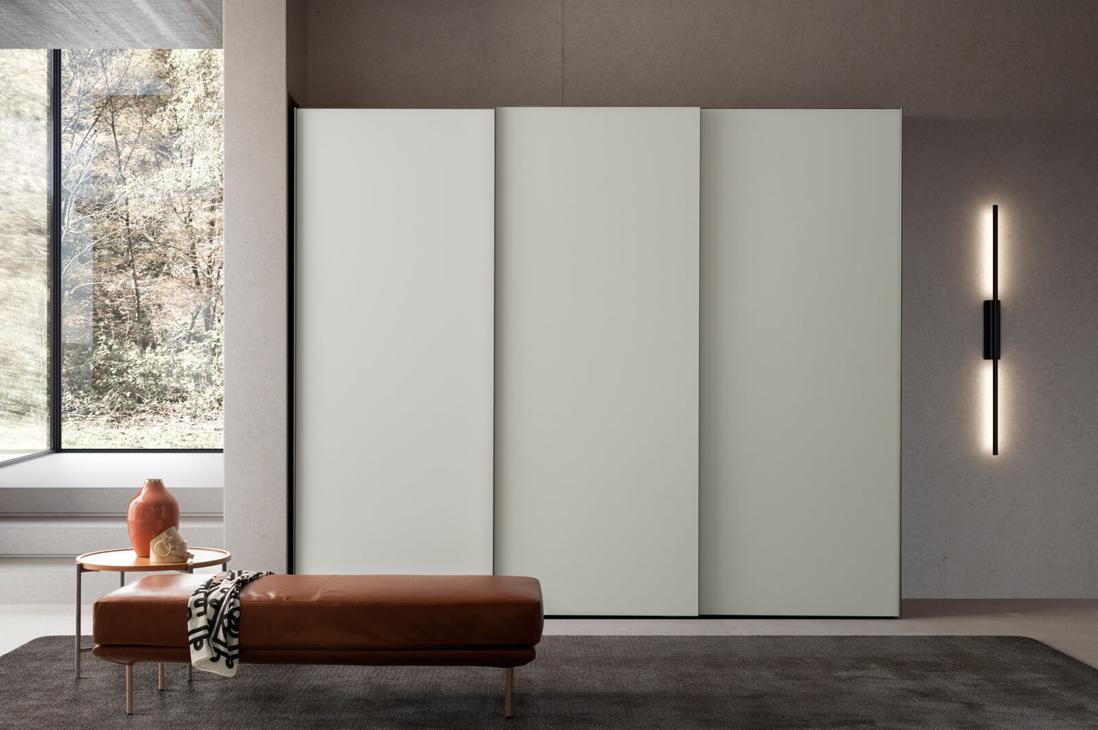 Full-height built-in wardrobe with matte lacquer doors and integrated handles
